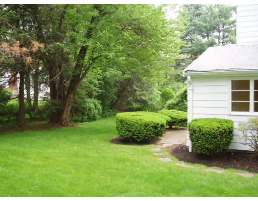70 Boulder Road Newton, MA 02459 - Photo 4 of 12 a view of a backyard with a garden