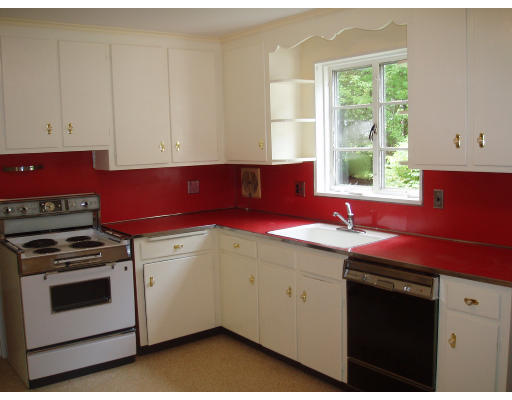 70 Boulder Road Newton, MA 02459 - Photo 10 of 12 a kitchen with a sink stove and cabinets