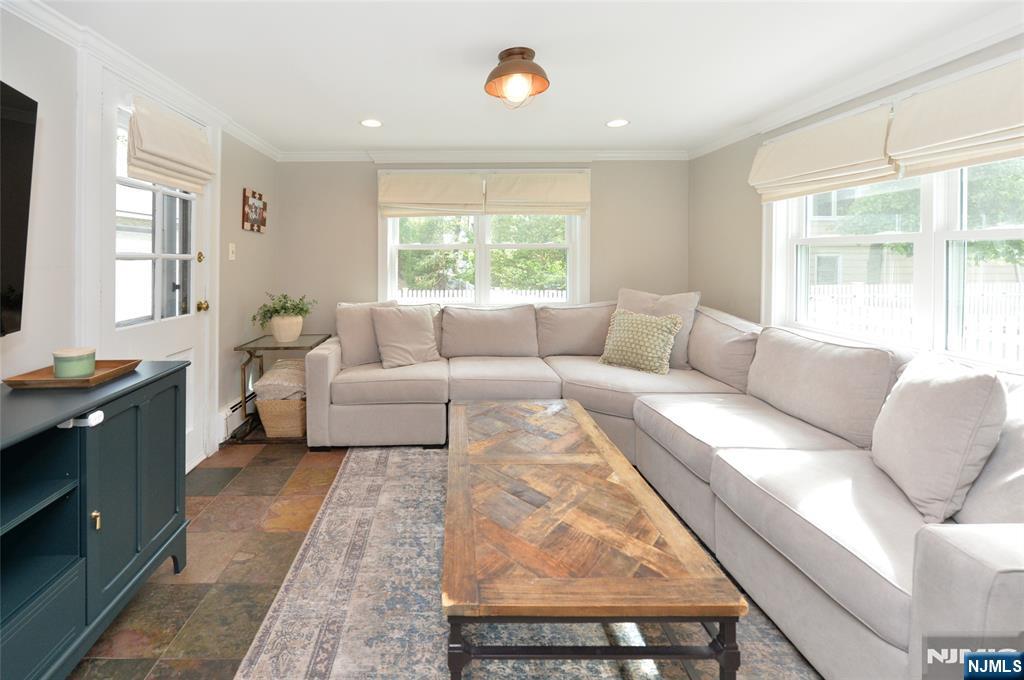 570 Shelton Road Ridgewood, NJ 07450 - Photo 13 of 26 a living room with furniture and a large window
