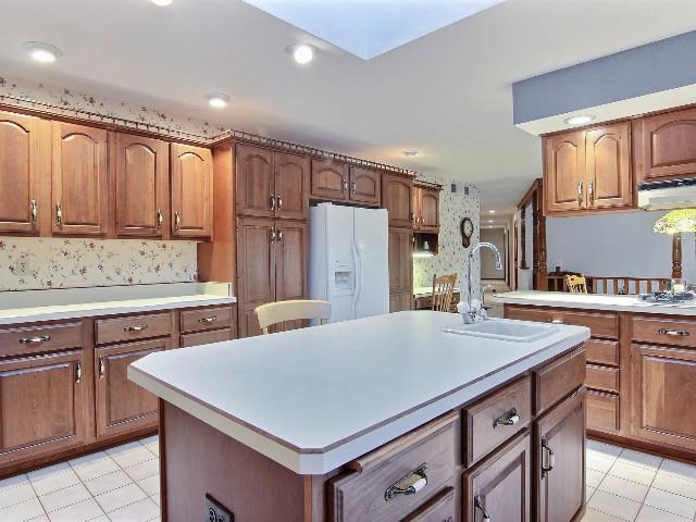 724 Timber Ridge Trail Rockford, IL 61114 - Photo 4 of 21 a kitchen with refrigerator cabinets and a sink
