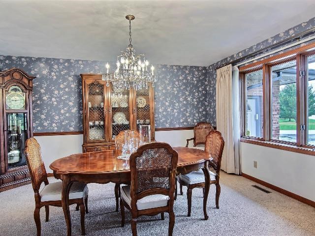724 Timber Ridge Trail Rockford, IL 61114 - Photo 7 of 21 a view of a dining room with furniture window and outside view