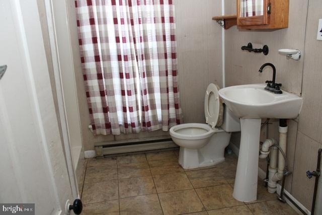14611 Roosevelt Avenue Cascade, MD 21719 - Photo 12 of 20 a bathroom with a sink toilet and shower