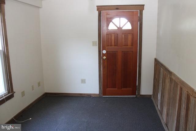 14611 Roosevelt Avenue Cascade, MD 21719 - Photo 5 of 20 an empty room with windows view and front door