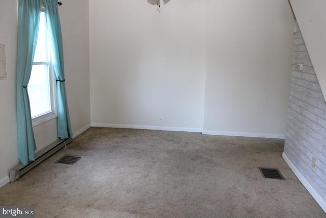 14611 Roosevelt Avenue Cascade, MD 21719 - Photo 6 of 20 a view of an empty room and a window