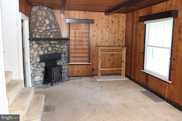 14611 Roosevelt Avenue Cascade, MD 21719 - Photo 7 of 20 a view of an empty room with a fireplace