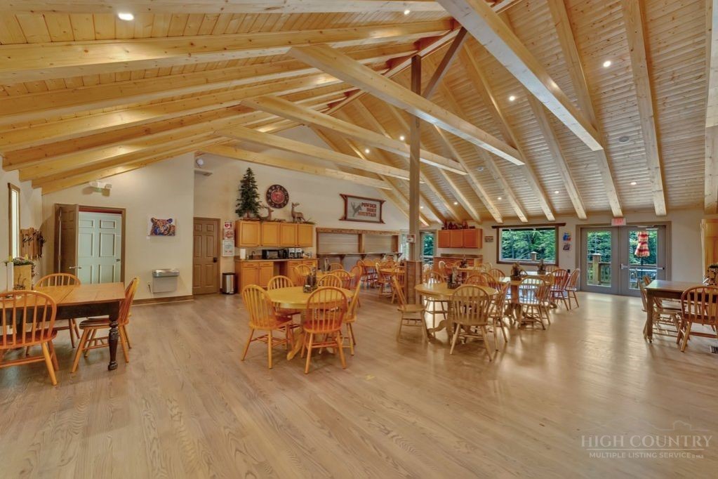 216 Saddle Lane Deep Gap, NC 28618 - Photo 42 of 44 a living room with lots of furniture and wooden floor