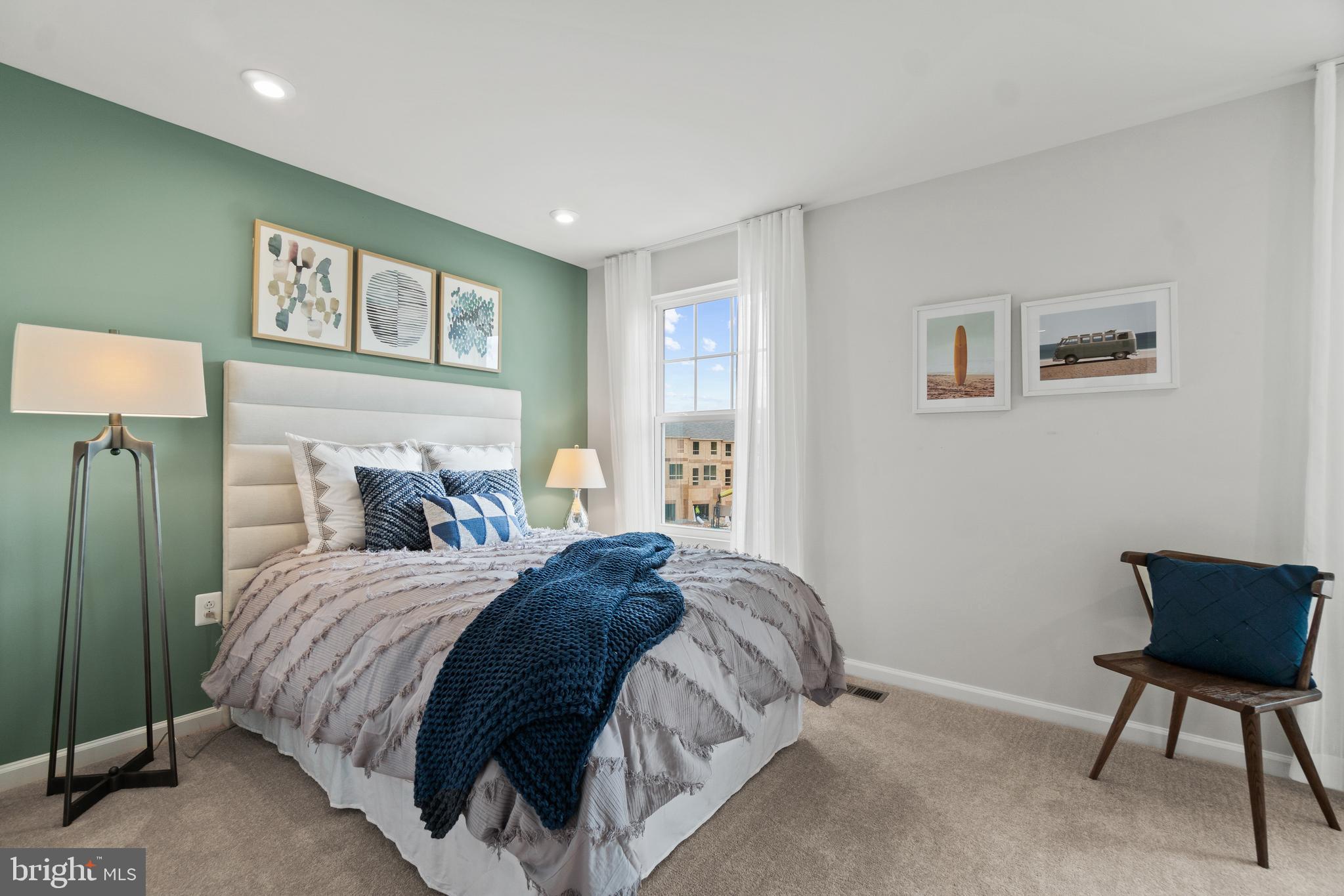 312 Presidents Pointe Avenue, Unit 612 Ranson, WV 25438 - Photo 21 of 87 a bedroom with a bed and a chair