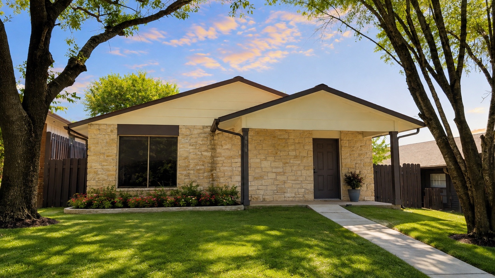 6016 Signal Point Austin, TX 78724 - Photo 1 of 20 AI was used for landscape A charming single-story home with a stone facade, a well-kept lawn, and mature trees offers inviting curb appeal.