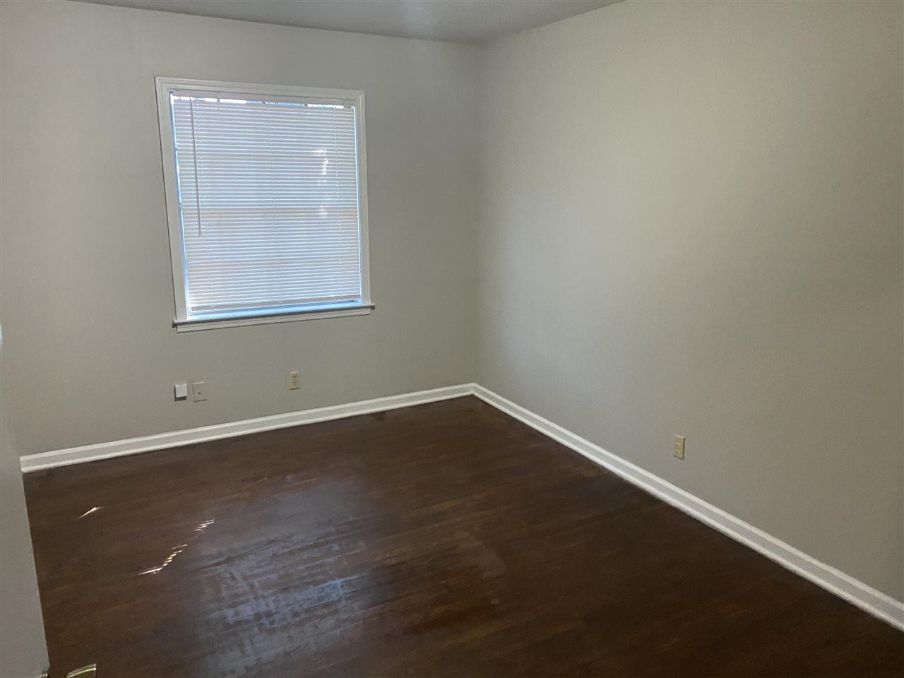 4066 Bishops Bridge Road Memphis, TN 38118 - Photo 11 of 19 an empty room with wooden floor and windows