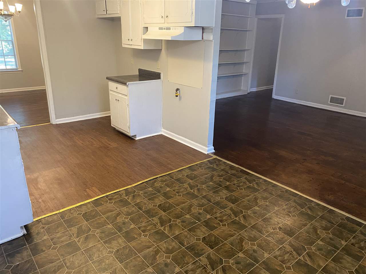 4066 Bishops Bridge Road Memphis, TN 38118 - Photo 5 of 19 an empty room with wooden floor and cabinet