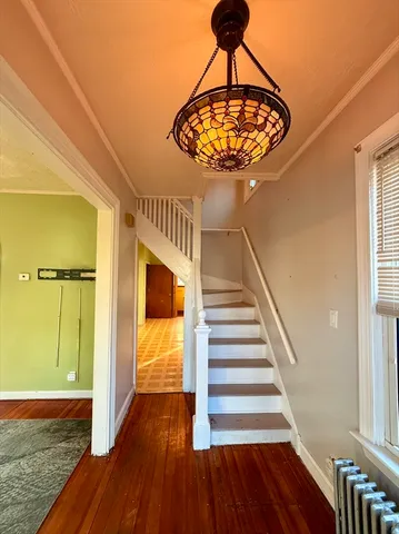 a view of entryway with wooden floor
