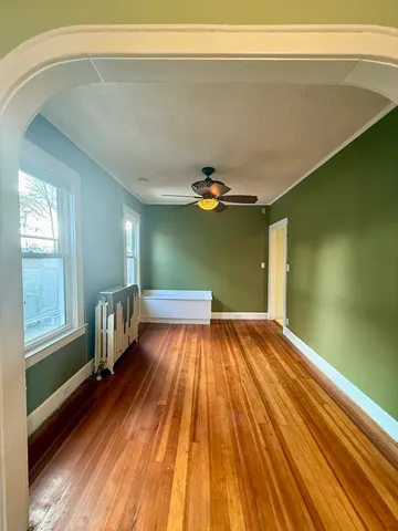 a bedroom with a bed and a mirror