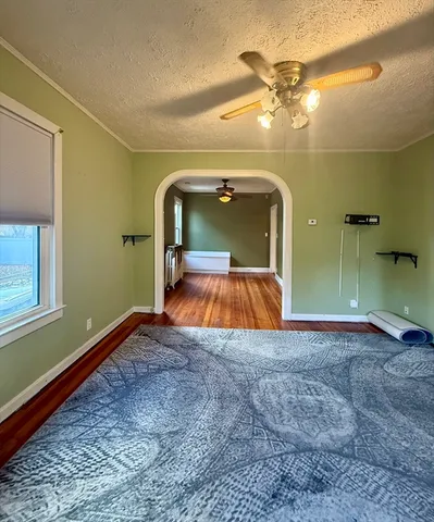 a room with wooden floor and a window