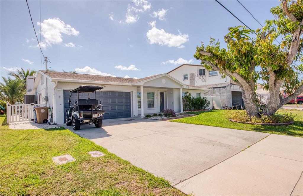 551 Crystal Drive Madeira Beach, FL 33708 - Photo 1 of 46 a view of a house with swimming pool and sitting area