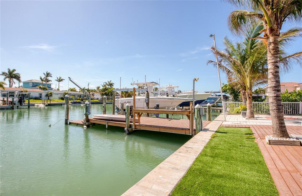551 Crystal Drive Madeira Beach, FL 33708 - Photo 12 of 46 a view of a lake with boats and trees