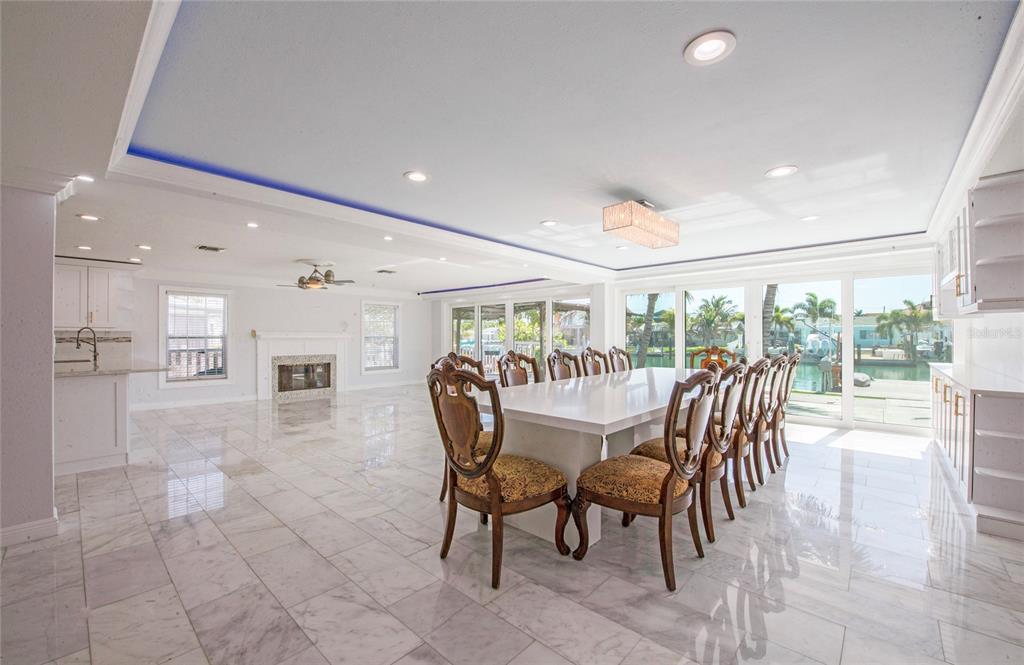 551 Crystal Drive Madeira Beach, FL 33708 - Photo 17 of 46 a dining room with furniture and large windows