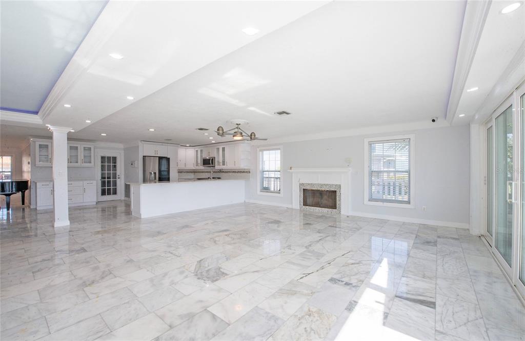 551 Crystal Drive Madeira Beach, FL 33708 - Photo 20 of 46 a view of livingroom with fireplace and window