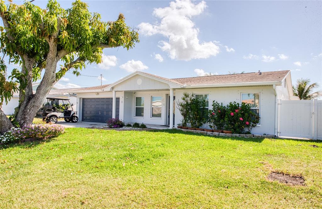 551 Crystal Drive Madeira Beach, FL 33708 - Photo 3 of 46 a view of a house with swimming pool and porch with furniture
