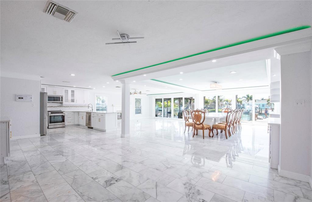 551 Crystal Drive Madeira Beach, FL 33708 - Photo 31 of 46 a view of a dining room with furniture and a view of living room