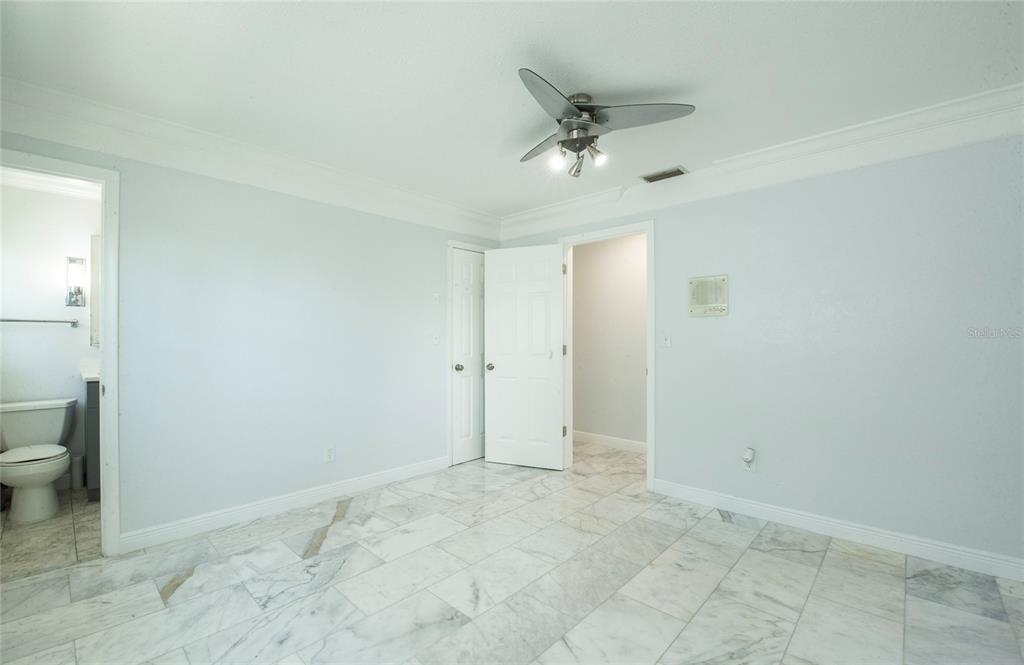 551 Crystal Drive Madeira Beach, FL 33708 - Photo 39 of 46 a view of a bathroom with a toilet