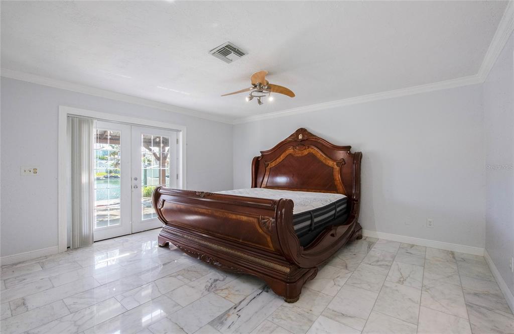 551 Crystal Drive Madeira Beach, FL 33708 - Photo 44 of 46 a room with a bed and a window