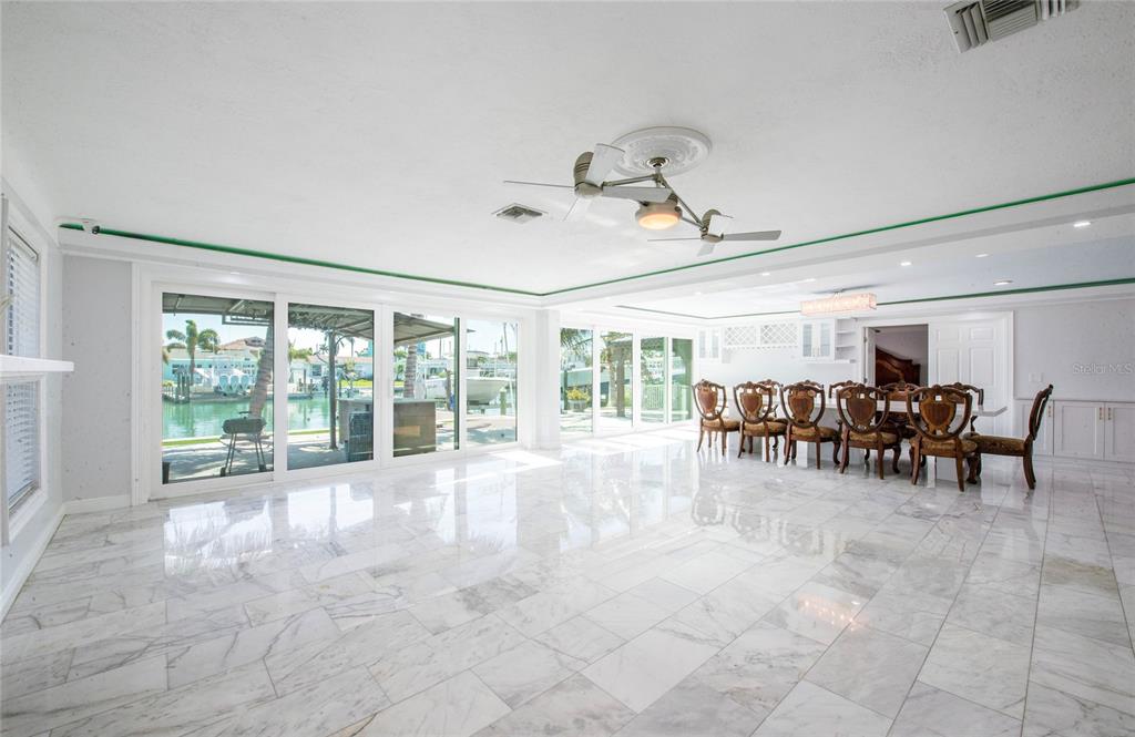 551 Crystal Drive Madeira Beach, FL 33708 - Photo 46 of 46 a view of a dining room with furniture window and outside view