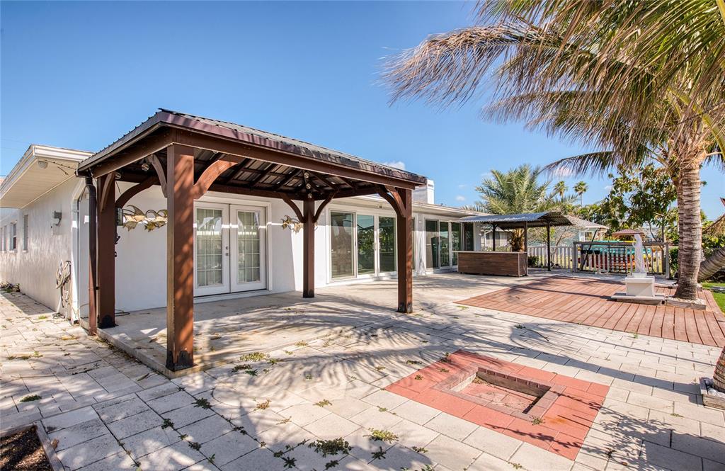 551 Crystal Drive Madeira Beach, FL 33708 - Photo 8 of 46 a front view of a house with a yard