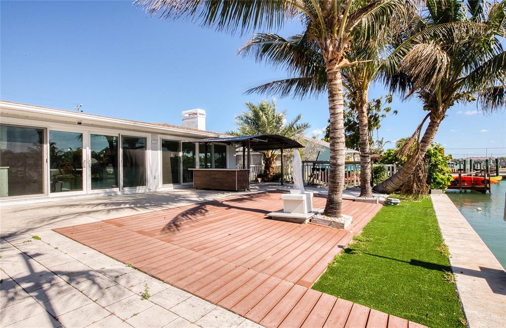 551 Crystal Drive Madeira Beach, FL 33708 - Photo 10 of 46 a view of a house with swimming pool and sitting area