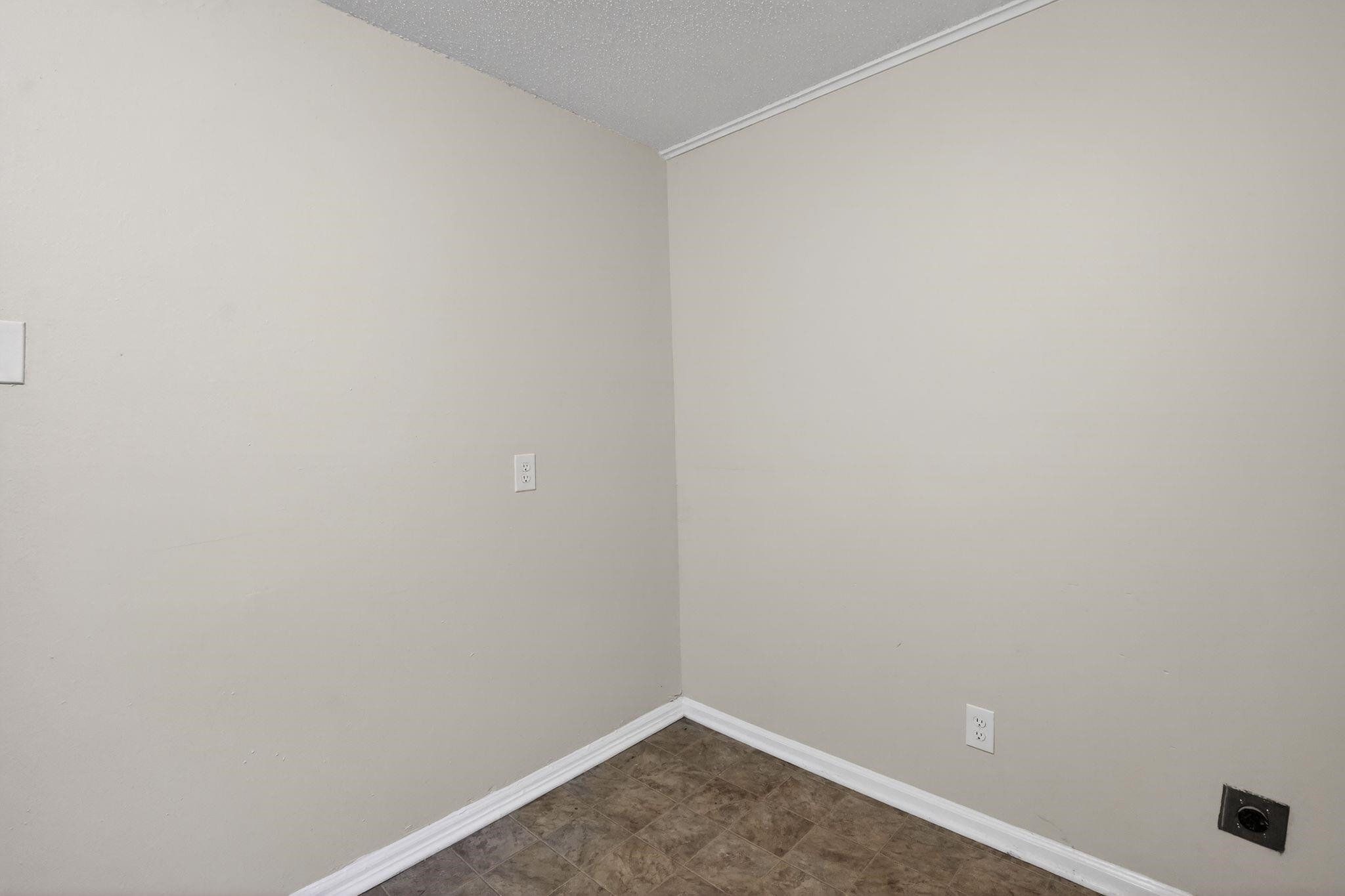 4689 Raleigh Lagrange Road Memphis, TN 38128 - Photo 15 of 30 Unfurnished room with baseboards and a textured ceiling