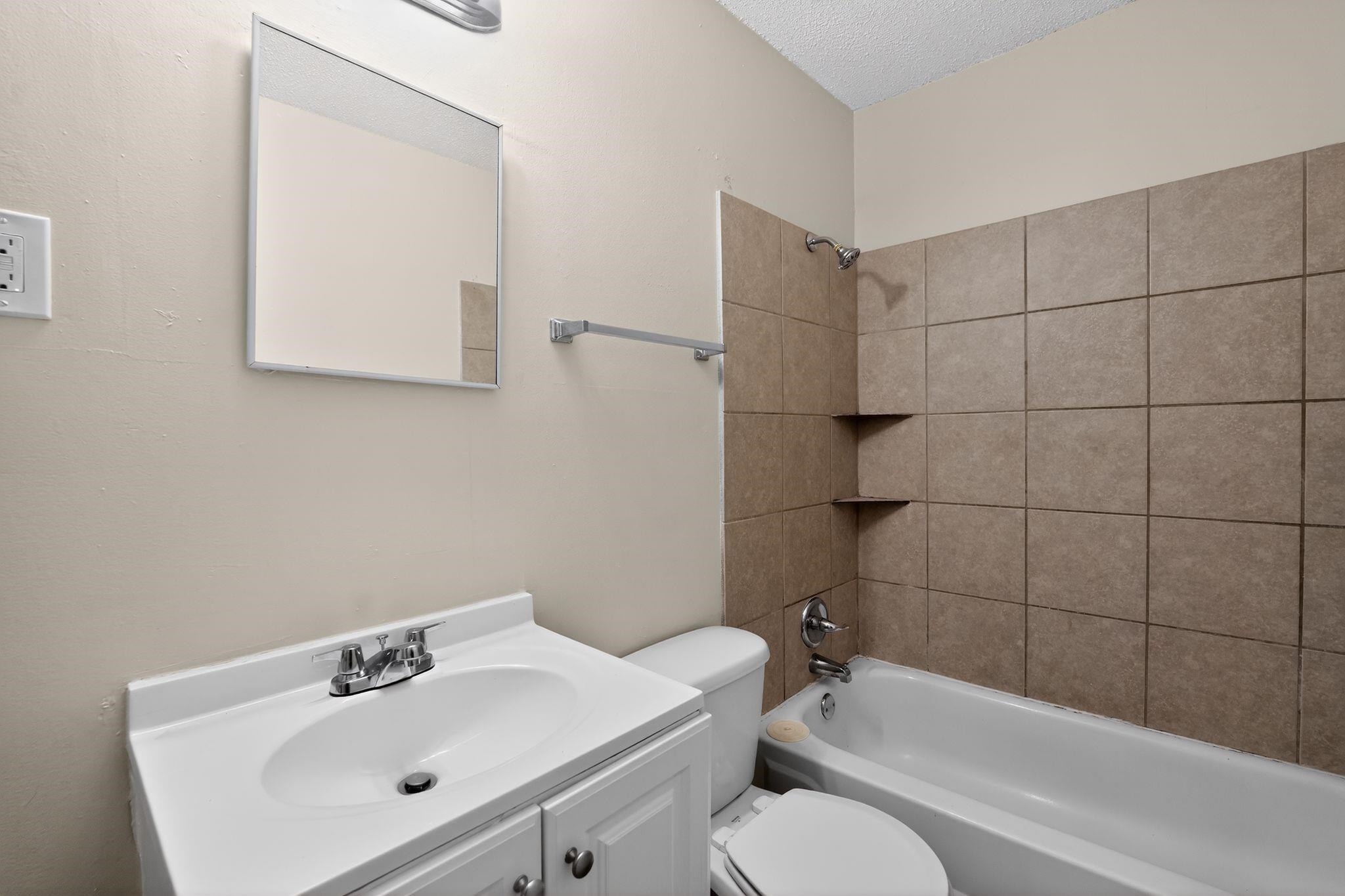 4689 Raleigh Lagrange Road Memphis, TN 38128 - Photo 25 of 30 Bathroom featuring tub / shower combination, vanity, and a textured ceiling