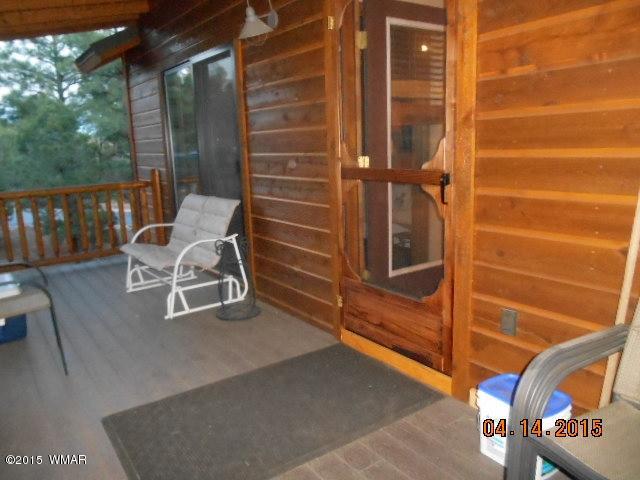 4890 West Cottage Loop Show Low, AZ 85901 - Photo 27 of 28 a view of an outdoor space and seating area