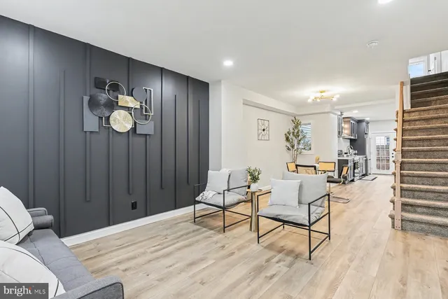a view of a livingroom with furniture and wooden floor