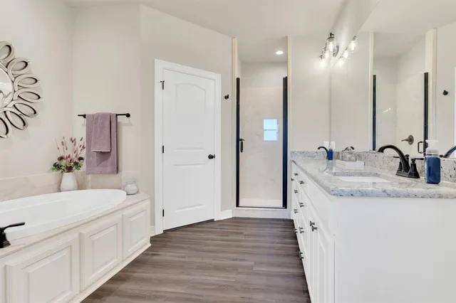 a front view of a house with a yard and seating space