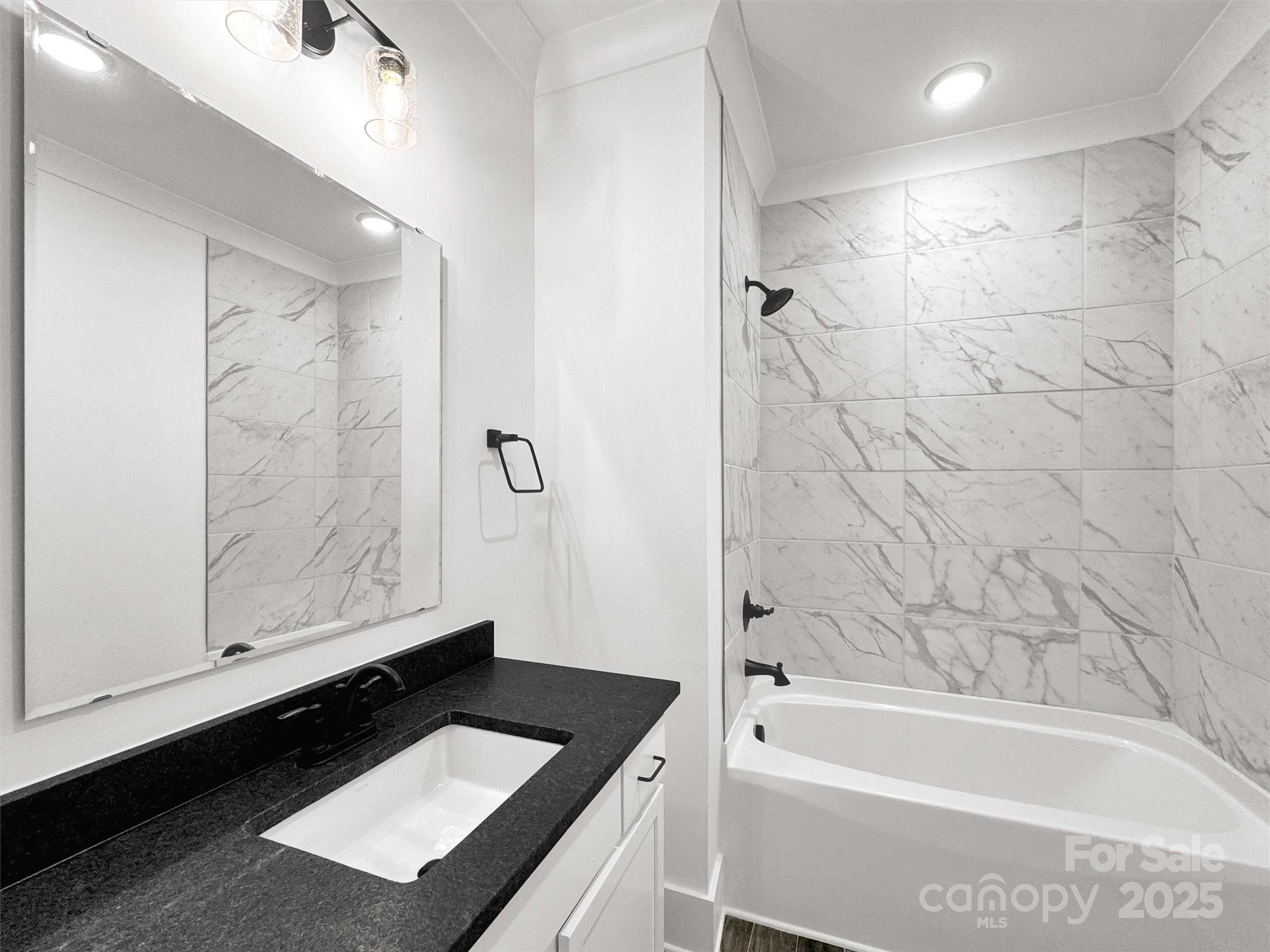 12 Whitson Road Asheville, NC 28805 - Photo 17 of 18 a bathroom with a bathtub and a shower