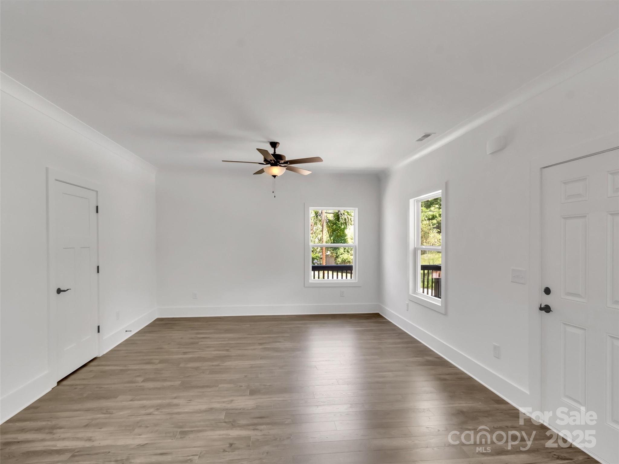 12 Whitson Road Asheville, NC 28805 - Photo 5 of 18 wooden floor in an empty room with a window