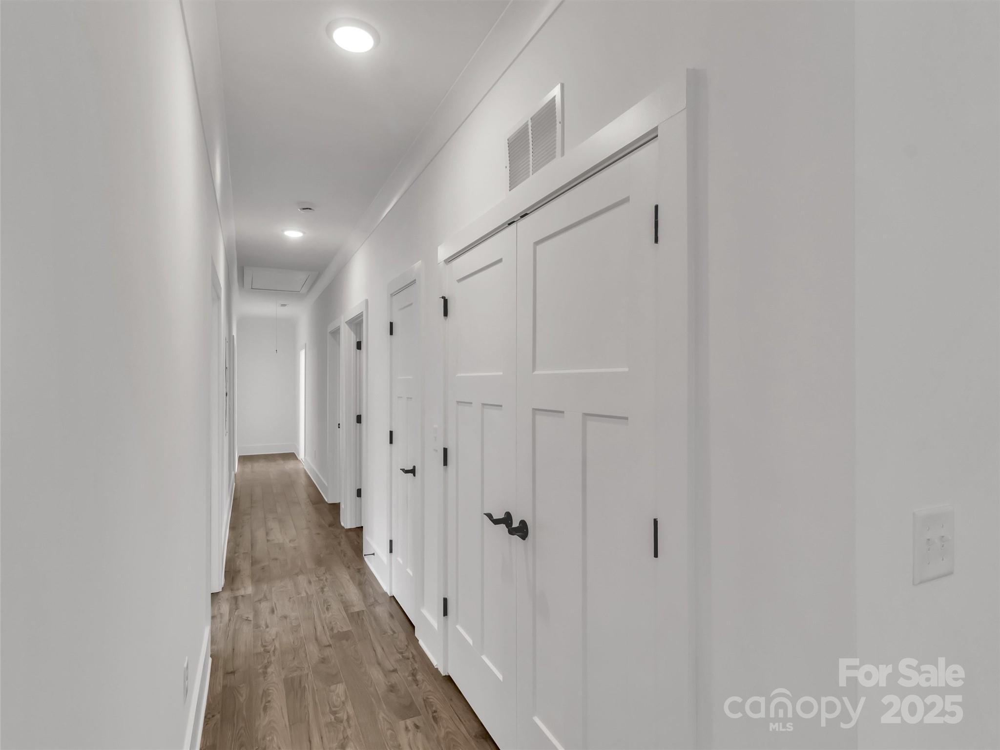 12 Whitson Road Asheville, NC 28805 - Photo 7 of 18 a view of a hallway with wooden floor
