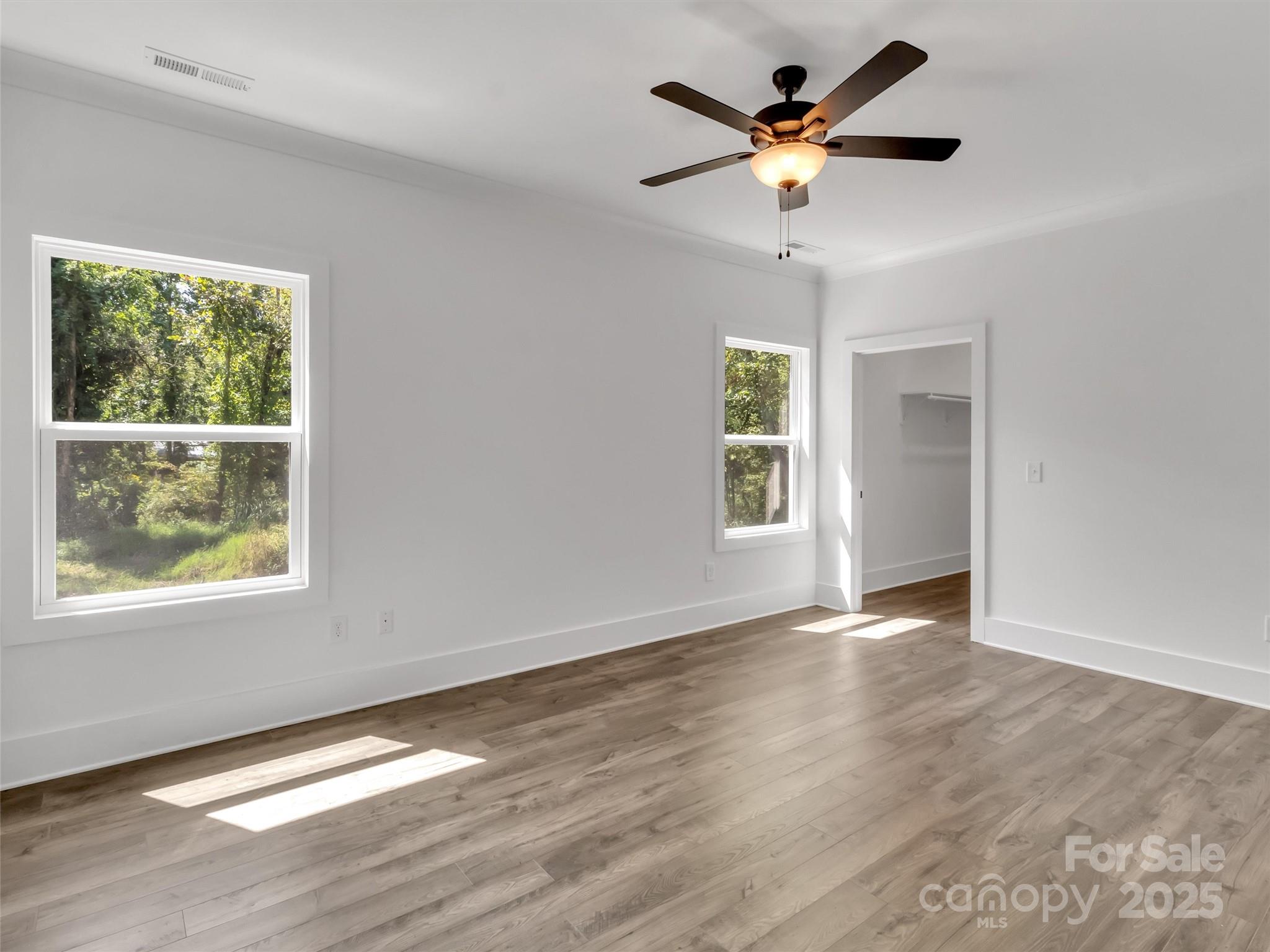 12 Whitson Road Asheville, NC 28805 - Photo 8 of 18 a view of an empty room with window and wooden floor