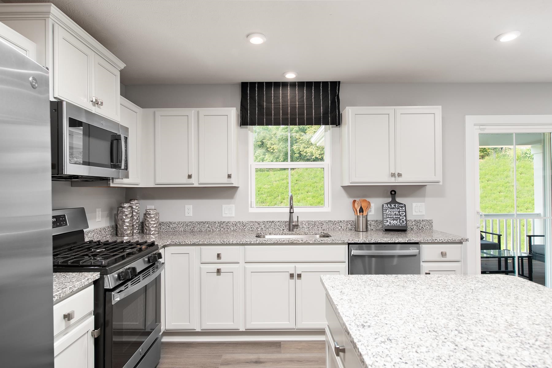 3745 Mayfield Road Mount Crawford, VA 22841 - Photo 2 of 13 a kitchen with stainless steel appliances granite countertop white cabinets granite counter tops and a window
