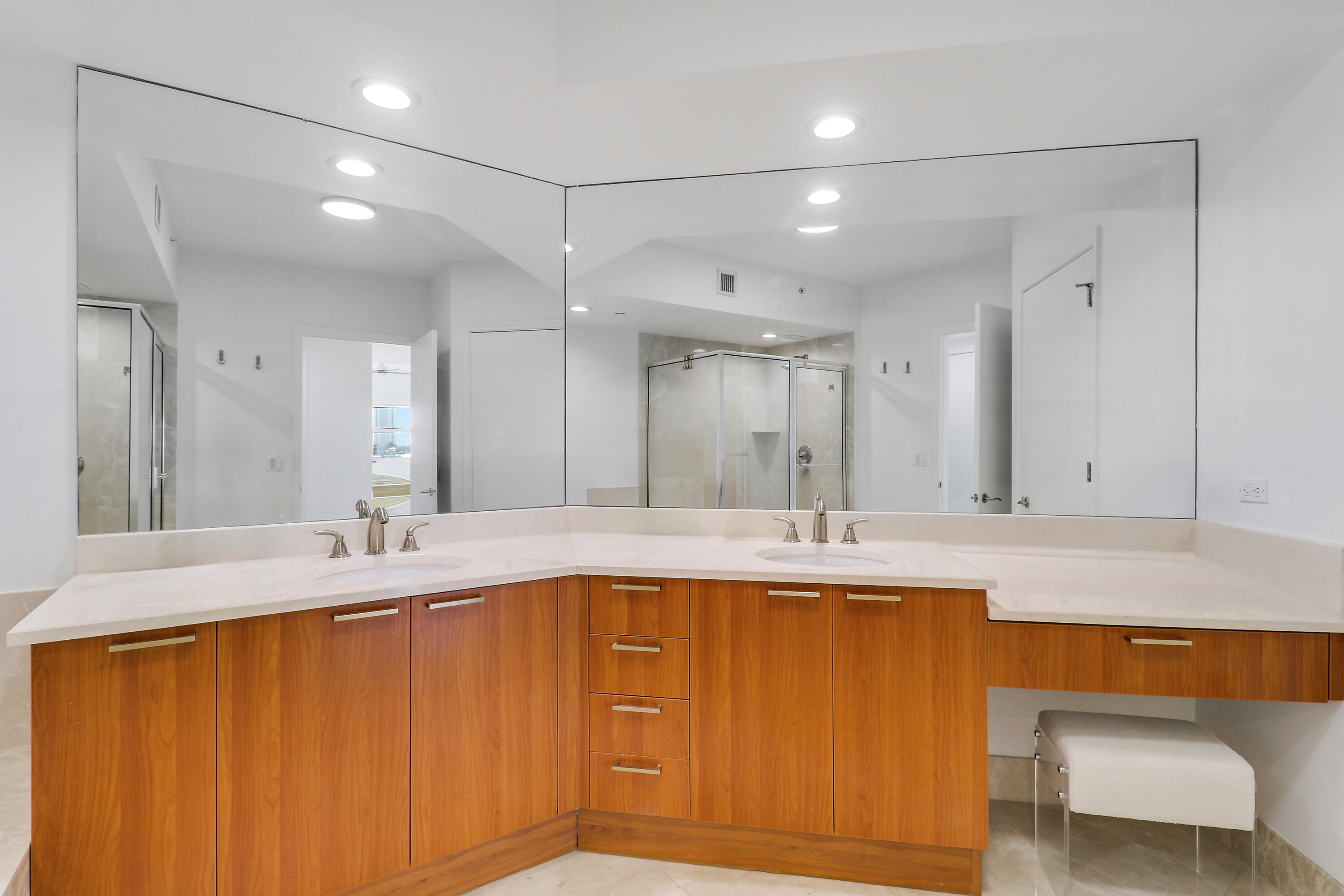 2640 Lake Shore Drive, Unit 307 Riviera Beach, FL 33404 - Photo 31 of 44 a bathroom with a tub sink and mirror
