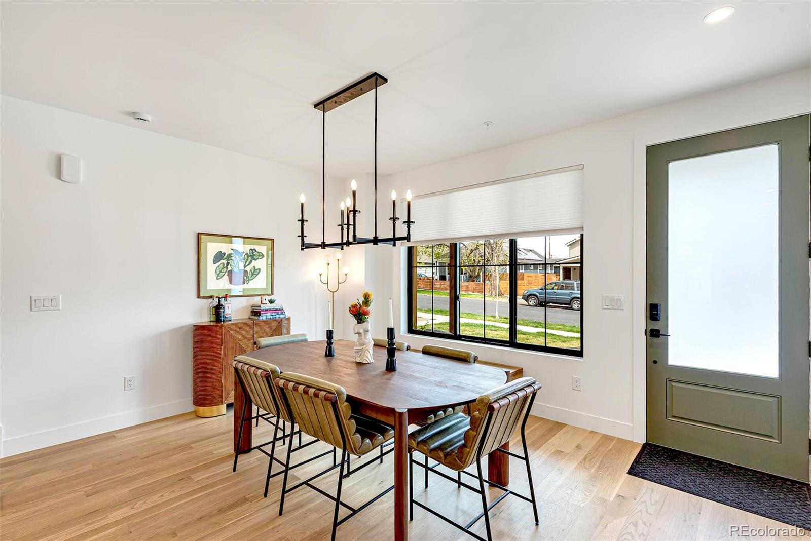 2455 Chase Street Edgewater, CO 80214 - Photo 13 of 46 a view of a dining room with furniture window and wooden floor