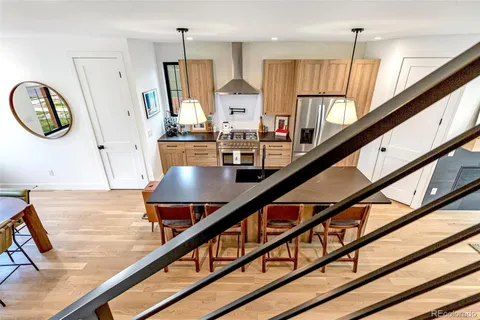 a bedroom with a large bed and a large window