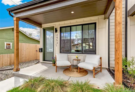a building outdoor space with patio furniture and potted plants