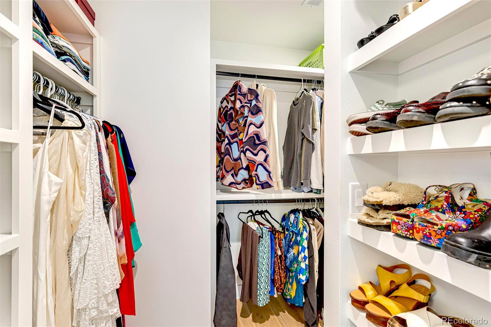 2455 Chase Street Edgewater, CO 80214 - Photo 23 of 46 a view of walk in closet with clothes and shoes