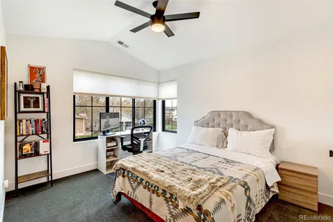 a bedroom with a bed and a view of bedroom