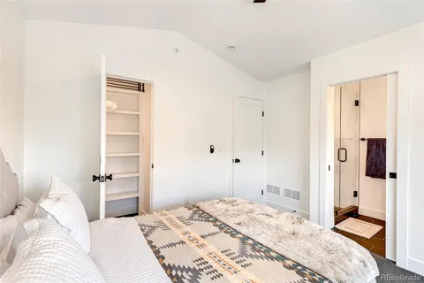 a bathroom with a sink vanity and a mirror