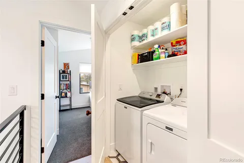 a bedroom with a bed and a desk