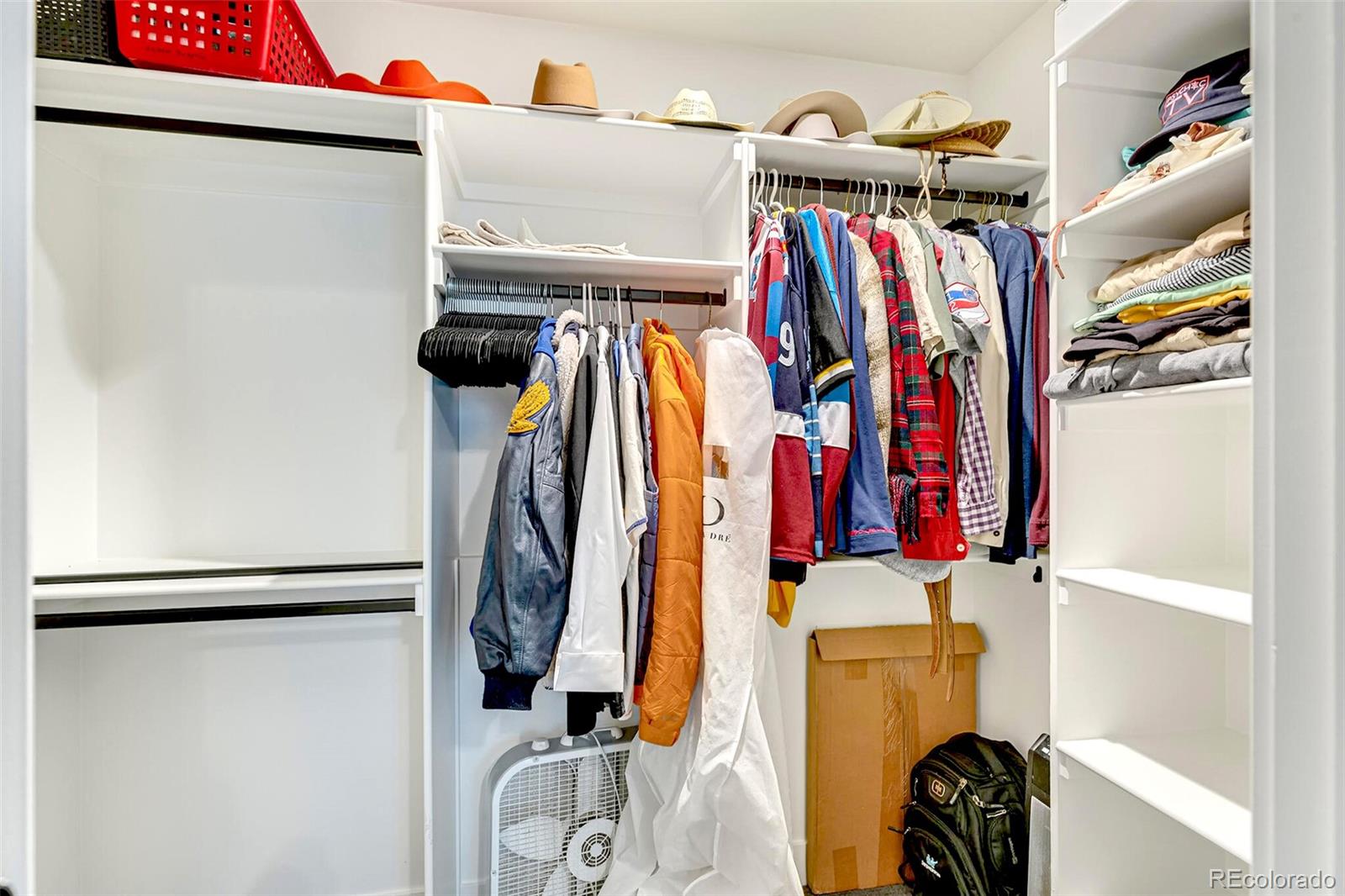 2455 Chase Street Edgewater, CO 80214 - Photo 35 of 46 a view of walk in closet with clothes and shoes