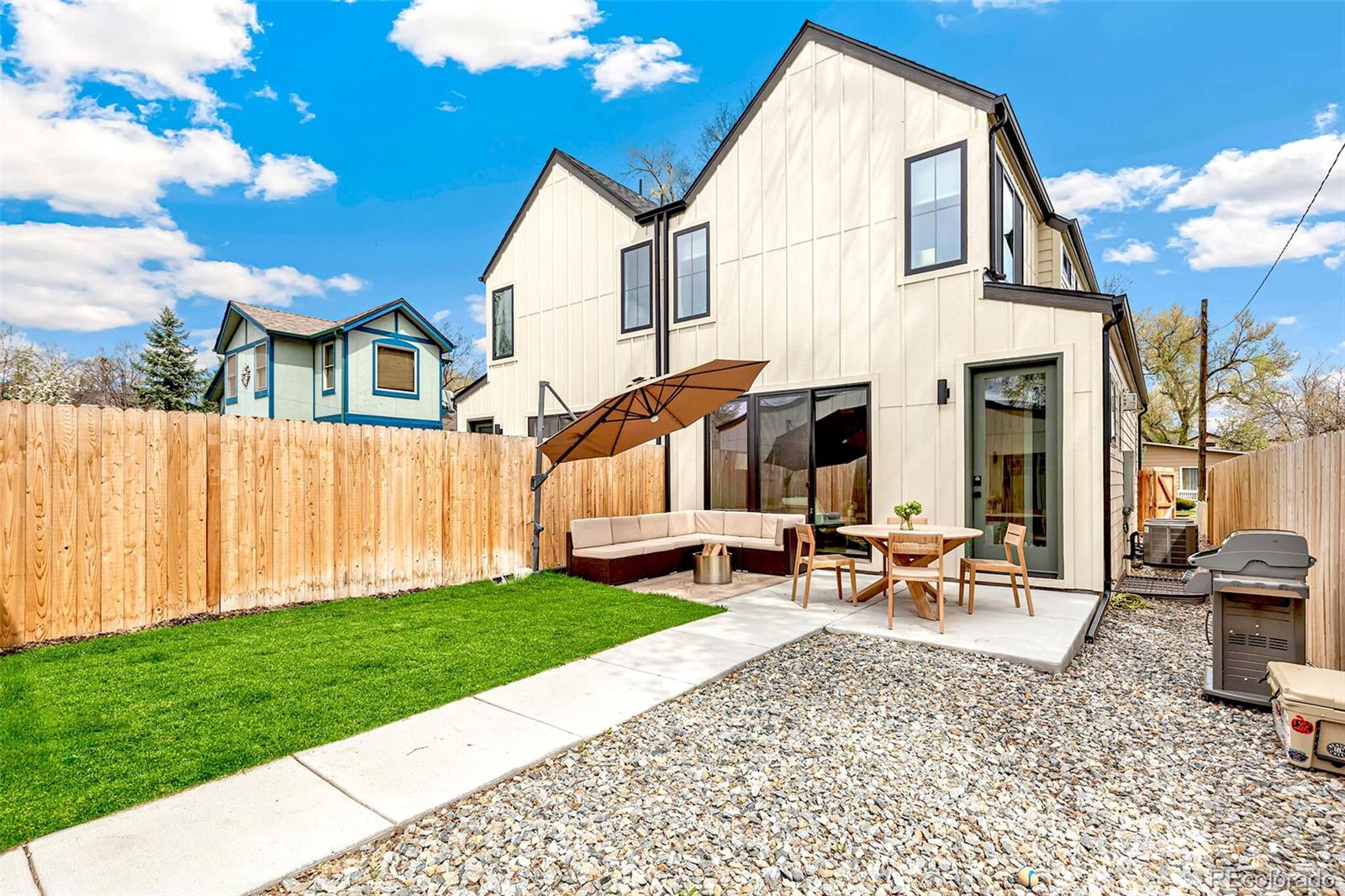 2455 Chase Street Edgewater, CO 80214 - Photo 37 of 46 a view of a house with a yard and sitting area