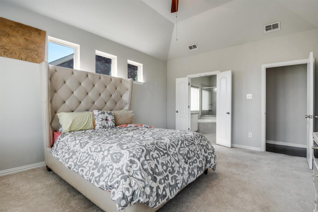 1316 Torrington Lane Forney, TX 75126 - Photo 18 of 36 a bedroom with a bed and lamp