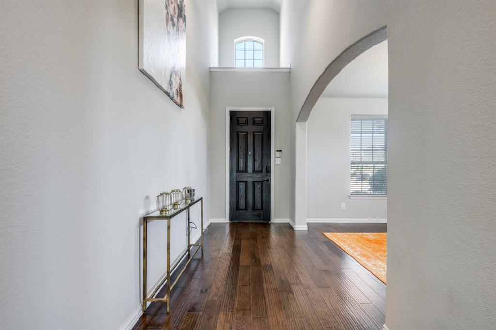 1316 Torrington Lane Forney, TX 75126 - Photo 2 of 36 a view of a hallway view with wooden floor and staircase